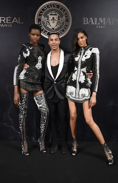 Grace Bol, Olivier Rousteingand, and Cindy Bruna attends the L'Oreal Paris X Balmain event  as part of the Paris Fashion Week Womenswear  Spring/Summer 2018 on September 28, 2017 in Paris, France. (Photo by Pascal Le Segretain/Getty Images)
