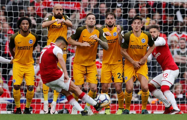 Arsenal's Alexis Sanchez shoots at goal from a free kick during the English Premier League football match between Arsenal and Brighton at the Emirates Stadium in London, October 1, 2017. (Photo by Eddie Keogh/Reuters)