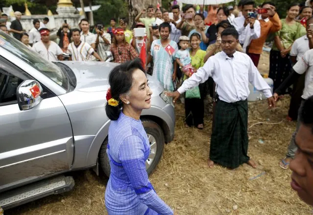 Myanmar opposition leader Aung San Suu Kyi arrives to give a speech during her campaign for the upcoming general election in Hpasaung, Kayah state, September 11, 2015. Suu Kyi on Thursday urged voters to opt for “real change” in the first general election since the end of military rule. (Photo by Soe Zeya Tun/Reuters)