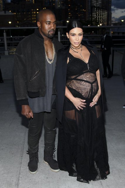 Kanye West, left, Kim Kardashian, attend the New York Fashion Week Spring/Summer 2016 Givenchy fashion show on Friday, September 11, 2015, in New York. (Photo by Andy Kropa/Invision/AP Photo)