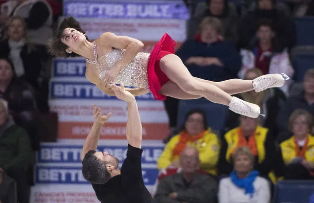 Canada's Meagan Duhamel and Eric Radford perform their free program in the pair's competition at Skate Canada International figure skating tournament in Regina, Saskatchewan, Saturday, October 28, 2017. (Photo by Paul Chiasson/The Canadian Press via AP Photo)