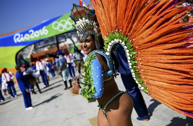 2016 Rio Olympics, Athletics, Final, Women's Marathon, Sambodromo, Rio de Janeiro, Brazil on August 14, 2016. A samba dancer reacts in Sambodromo. (Photo by Dylan Martinez/Reuters)