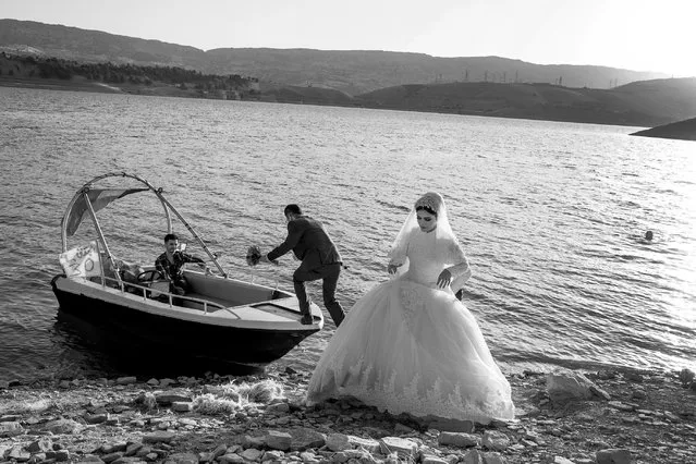 Shadows of Kurdistan: Murat Yazar, Turkey; Shortlist, Discovery. A couple taking a boat tour in Lake Dukan in Iraq before their wedding celebration. “I was born in a Kurdish village in southeastern Turkey and, like millions of Kurds in Turkey, Iran, Iraq and Syria, I have encountered problems while trying to express my Kurdish identity. We live in our land like shadows, without colour, which is why I decided to call this project Shadows of Kurdistan. It was also important to me that the vibrancy of Kurdish culture shone through”. (Photo by Murat Yazar/Sony World Photography Awards 2020)