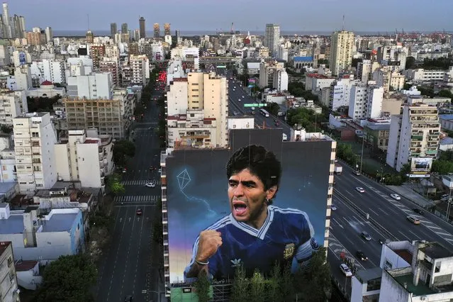 Aerial view of a giant mural by artist Martin Ron depicting late football legend Diego Maradona on October 27, 2022 in Buenos Aires, Argentina. The work of art is expected to be concluded by October 30th, on Maradona's 62nd birth anniversary. (Photo by Gustavo Garello/Getty Images)