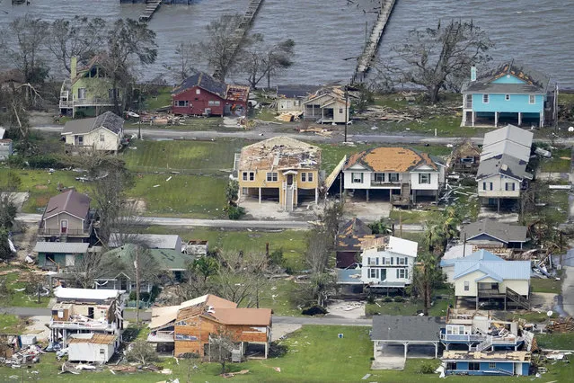 Buildings and homes are damaged in the aftermath of Hurricane Laura Thursday, August 27, 2020, near Lake Charles, La. (Photo by David J. Phillip/AP Photo)