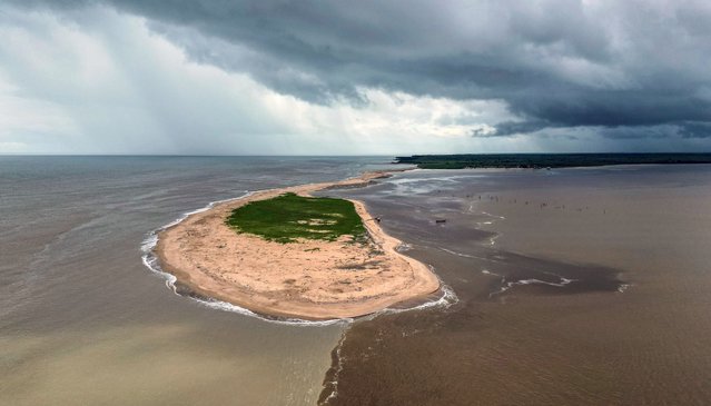 This aerial view shows the Braamsput Island in Paramaribo on May 24, 2025. Suriname, South America's smallest country, is preparing for an inflow of cash from a huge offshore oil find, with the president insisting the population will receive a direct share of the wealth. (Photo by Juan Barreto/AFP Photo)