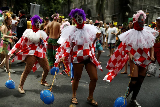 Revellers take part in the annual block party known as “Cordao do Boitata”, during carnival festivities in Rio de Janeiro, Brazil February 4, 2018. (Photo by Pilar Olivares/Reuters)