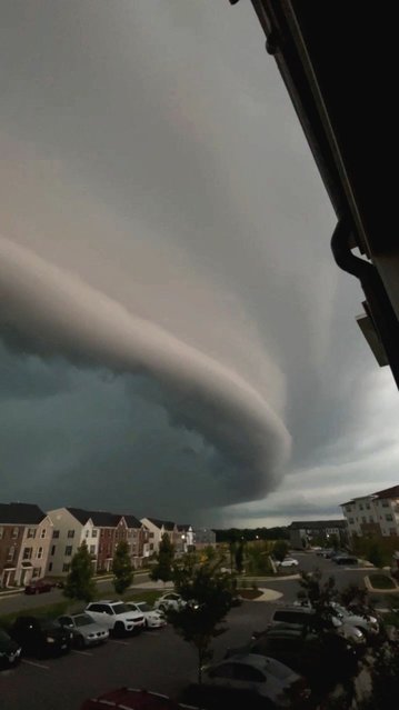A shelf cloud stretches across the skies above Bowie, Maryland, U.S., in this screengrab taken from a social media video released on July 9, 2025. (Photo by X/@CamFor44/via Reuters)
