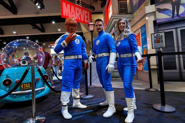 Booth attendees dressed as the Fantastic Four pose for a picture at the Marvel booth on the convention floor at Comic-Con International in San Diego, California, U.S. July 24, 2025. (Photo by Mike Blake/Reuters)