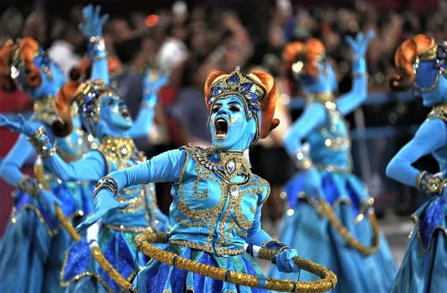 Performers from the Paraiso do Tuiuti samba school parade during Carnival celebrations at the Sambadrome in Rio de Janeiro, Brazil, Monday, February 20, 2023. (Photo by Silvia Izquierdo/AP Photo)