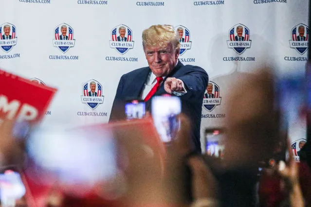 Former US President Donald Trump gestures to supporters during Trump's President Day event at the Hilton Palm Beach Airport in West Palm Beach, Florida, on February 20, 2023. (Photo by Giorgio Viera/AFP Photo)