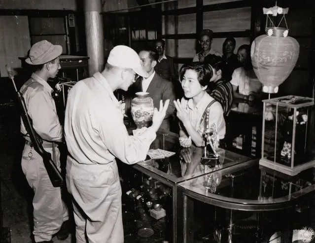 First troops in Tateyama, Japan in September 1945 visit souvenir shops. (Photo by National Archives and Records Administration)