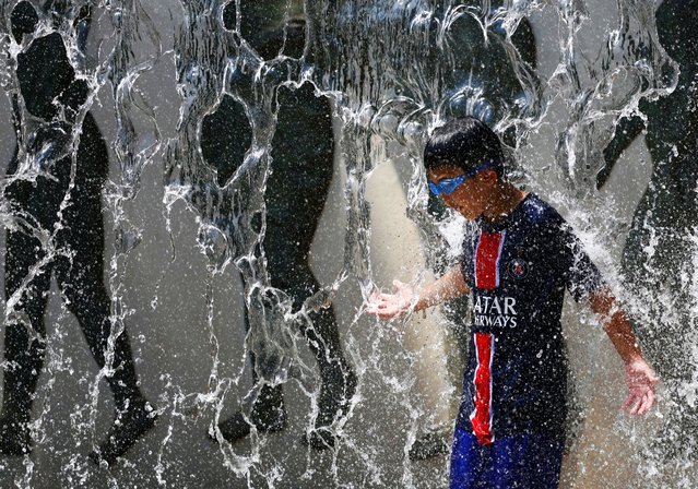 A 9 year old boy plays at a fountain to cool off at a park as the Japanese government issued a heatstroke alert in Tokyo and other prefectures due to a heatwave, in Tokyo, Japan, on August 4, 2025. (Photo by Issei Kato/Reuters)
