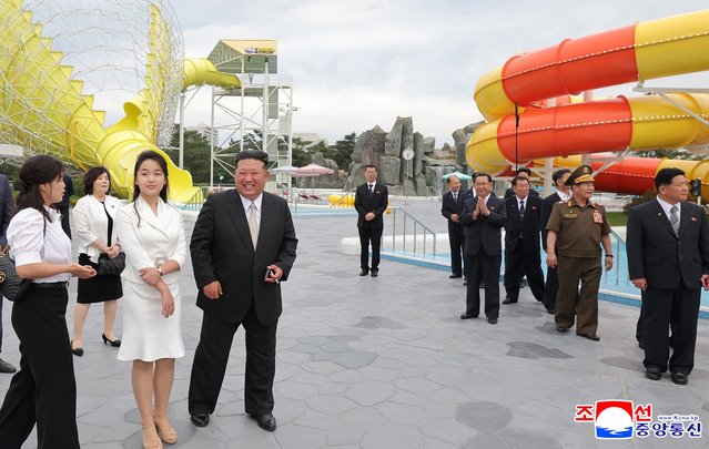 A photo released by the official North Korean Central News Agency (KCNA) shows North Korean leader Kim Jong Un (4-L) and his daughter Kim Ju Ae (3-L) during a ceremony marking the opening of the Wonsan Kalma Coastal Tourist Zone in Wonsan, North Korea, 24 June 2025. According to KCNA, the tourist zone features hotels and hostels with accommodations for nearly 20,000 guests, both domestic and international, as well as sea-bathing facilities, and various sports and recreation amenities. (Photo by KCNA/EPA)