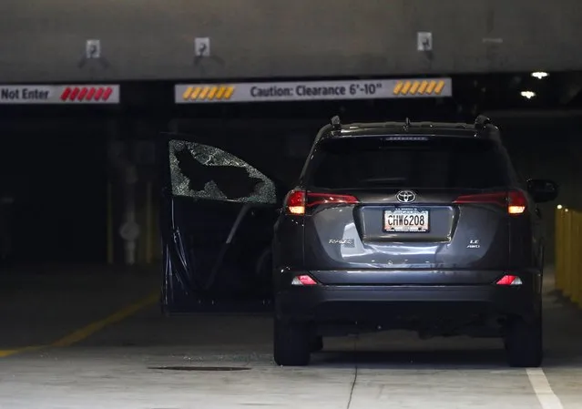A damaged car is seen near the crime scene following the shooting at Northside Medical, in Atlanta, Georgia, U.S. May 3, 2023. (Photo by Alyssa Pointer/Reuters)
