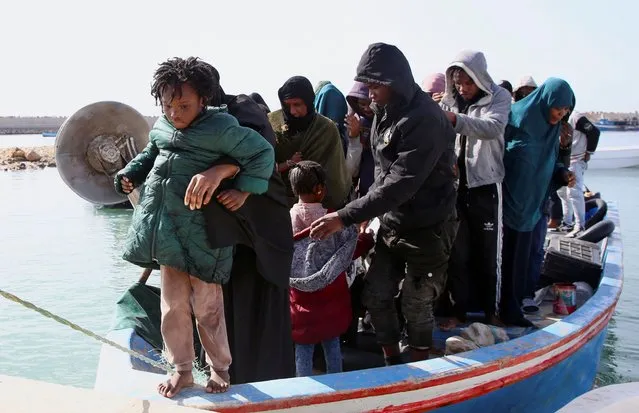 Migrants, whose boats sank in the sea and who were rescued by the Libyan Coast Guards at the Mediterranean Sea, arrive on a boat at the port, in Garaboli, Libya on April 25, 2023. (Photo by Hazem Ahmed/Reuters)
