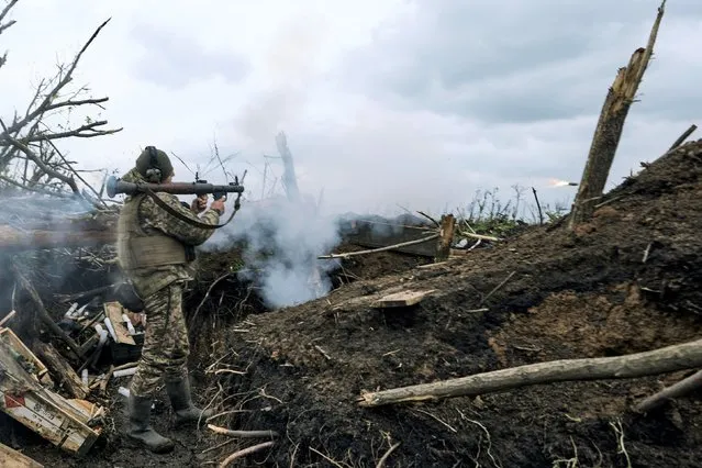 A Ukrainian soldier fires an RPG toward Russian positions at the frontline near Avdiivka, an eastern city where fierce battles against Russian forces have been taking place, in the Donetsk region, Ukraine, Friday, April 28, 2023. (Photo by Libkos/AP Photo)