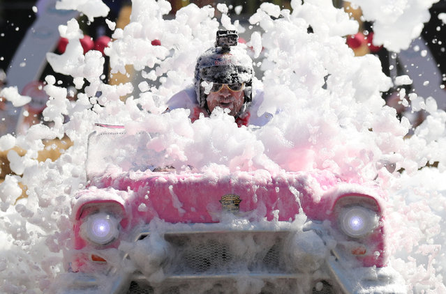 A participant drives his homemade vehicle without an engine during the Red Bull Soapbox Race in Almaty, Kazakhstan on August 31, 2024. (Photo by Pavel Mikheyev/Reuters)