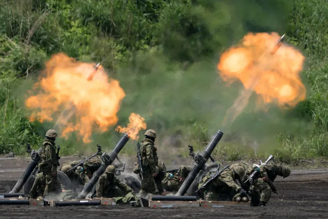 Members of the Japan Ground Self-Defense Force (JGSDF) take part in a live fire exercise at East Fuji Maneuver Area on May 27, 2023 in Gotemba, Shizuoka, Japan. The annual live-fire drill took place after G7 leaders discussed ways to further strengthen defense cooperation at their meeting in Hiroshima last week.  (Photo by Tomohiro Ohsumi/Getty Images)