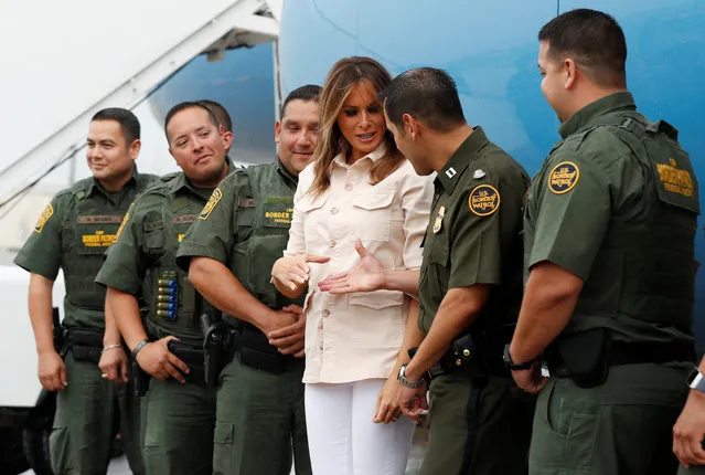First lady Melania Trump poses with U.S. Border Patrol officers at the McAllen airport as she prepares to depart after a visit to the U.S.-Mexico border area in McAllen Texas on June 21, 2018. (Photo by Kevin Lamarque/Reuters)