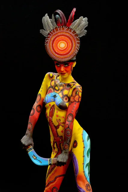 A participant poses with her body paintings designed by bodypainting artist Arianna Barlini during the 16th World Bodypainting Festival on July 5, 2013 in Poertschach am Woerthersee, Austria. (Photo by Didier Messens/Getty Images)