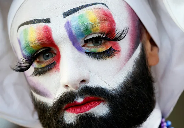 A participant poses while attending the inauguration of the Gay Games village at the Hotel de Ville city hall in Paris, France, August 4, 2018. (Photo by Regis Duvignau/Reuters)