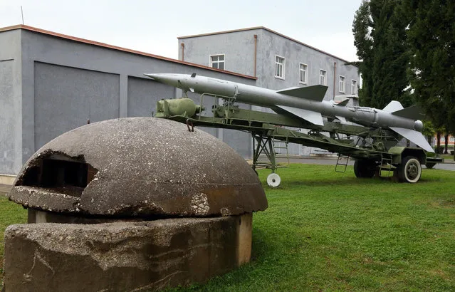 An old unused missile and a  bunker of the Albanian army are displayed at the Defense Ministry in the capital Tirana, Monday November 28, 2016, for the celebrations of Independence Day. Albania joined NATO in 2009, and since then has been replacing outdated weaponry with the new ones in line with the alliance's standards. (Photo by Hektor Pustina/AP Photo)