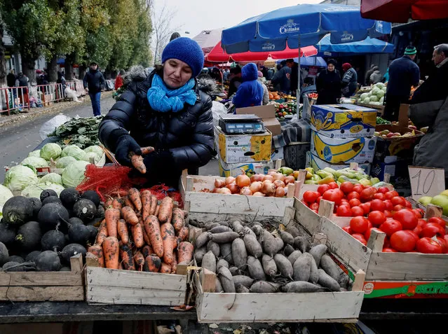 A street vendor sells vegetables in central Chisinau, Moldova, November 12, 2016. (Photo by Gleb Garanich/Reuters)