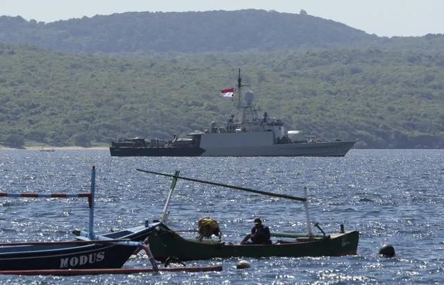 Indonesian Navy ship KRI Singa sails to take part in the search for submarine KRI Nanggala that went missing while participating in a training exercise on Wednesday, off Banyuwangi, East Java, Indonesia, Thursday, April 22, 2021. Indonesia's navy ships are intensely searching the waters where one of its submarines was last detected before it disappeared, as neighboring countries are set to join the complex operation. (Photo by AP Photo/Stringer)
