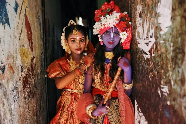 Hindu girls dressed as Radha and Lord Krishna during the Janmashtami festival, pose for a picture as the Hindu community celebrates the birth anniversary of Lord Krishna in Dhaka, Bangladesh on September 6, 2023. (Photo by Mohammad Ponir Hossain/Reuters)