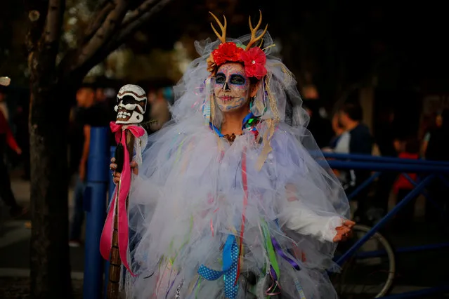 A woman in costume attends the Dia de los Muertos parade in Albuquerque, New Mexico, U.S., November 4, 2018. (Photo by Brian Snyder/Reuters)