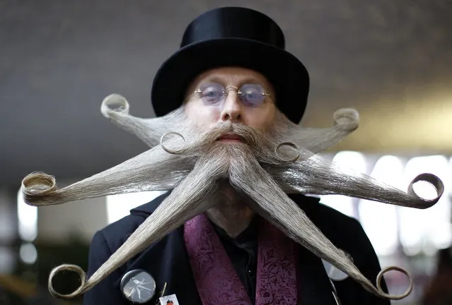 Armin Bielefeldt of the U.S. poses with his beard art work before the Beard World Championship 2013 in Leinfelden-Echterdingen near Stuttgart November 2, 2013. Bielefeldt needs more than 6 hours for his art work. More than 300 people from around the world compete in different moustache and beard categories. (Photo by Michaela Rehle/Reuters)