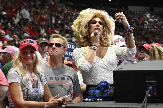 Elaine Lancaster of Miami, right, waits for President Donald Trump to speak at a rally in Estero, Fla., Wednesday, October 31, 2018. Trump is campaigning for Florida Republican Gov. Rick Scott, who is challenging incumbent Democratic Sen. Bill Nelson for a seat in the Senate. (Photo by Susan Walsh/AP Photo)
