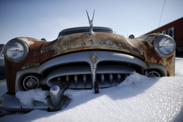 Classic antique cars are seen at an auto dealer in West Branch, Iowa, March 6, 2015. Iowa, the American heartland. Endless farm fields and quiet towns. 56,273 square miles that are soon to become the focus of the nation as the long process of electing the next U.S. president begins. (Photo by Jim Young/Reuters)