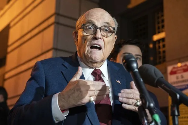Former New York Mayor Rudy Giuliani talks to reporters as he leaves the federal courthouse in Washington, Monday, December 11, 2023. The trial will determine how much Giuliani will have to pay two Georgia election workers who he falsely accused of fraud while pushing President Donald Trump's baseless claims after he lost the 2020 election. (Photo by Jose Luis Magana/AP Photo)