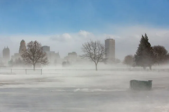 The city skyline is seen in drifting snow during the polar vortex in Buffalo, New York, U.S., January 31, 2019. (Photo by Lindsay DeDario/Reuters)