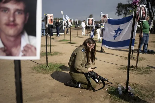 An Israeli soldier weeps at the marker for a loved one kidnapped on Oct. 7 in a cross-border attack by Hamas at the Nova music festival, after a press conference at the site in Re'im, southern Israel, Friday, January 5, 2024. (Photo by Maya Alleruzzo/AP Photo)