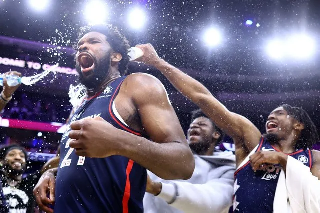 Joel Embiid #21 of the Philadelphia 76ers reacts after being showered with water after defeating the San Antonio Spurs at the Wells Fargo Center on January 22, 2024 in Philadelphia, Pennsylvania. Embiid scored a franchise-record 70 points in the game. (Photo by Tim Nwachukwu/Getty Images/AFP Photo)