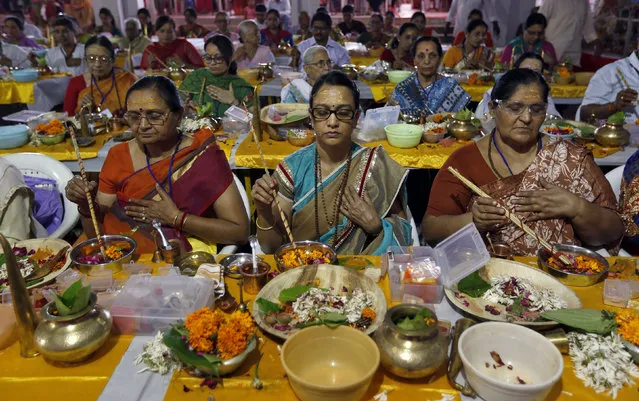 Hindu devotees offer prayers during the Mahashivratri festival in Ahmedabad, India, March 7, 2016. Hindus across the country celebrate Mahashivratri, better known as Lord Shiva's wedding anniversary. (Photo by Amit Dave/Reuters)