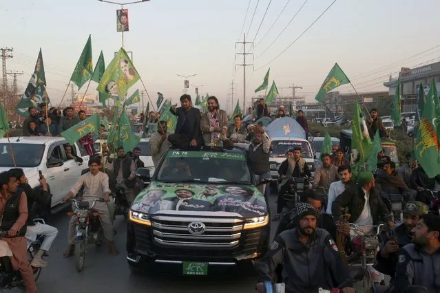 Qari Zahir Shah, center right on vehicle, a winning candidate from Pakistan's former prime minister Nawaz Sharif's party 'Pakistan Muslim League-N, leads rally with his supporters to celebrate his victory in the parliamentary elections, in Peshawar, Pakistan, Sunday, February 11, 2024. (Photo by Muhammad Sajjad/AP Photo)