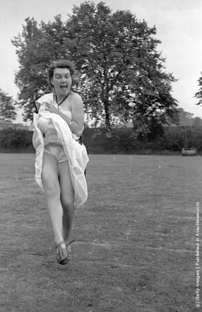 1948:  One of the students shows a little more leg than necessary at a cricket match at the Goldsmith's Art College end of term party in London