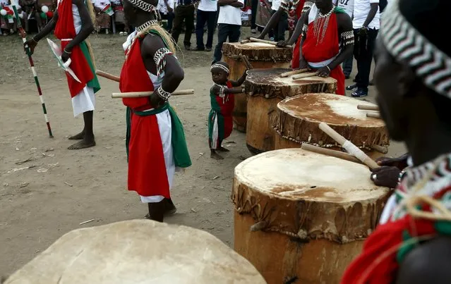 A boy stands next to drums during a rally supporting Burundi's President Pierre Nkurunziza in Bujumbura, Burundi, May 17, 2015. President Nkurunziza makes his first public appearance in the capital Bujumbura since an attempted coup last week failed to oust him from power, saying he is monitoring a threat posed by Islamist militants from Somalia. (Photo by Goran Tomasevic/Reuters)