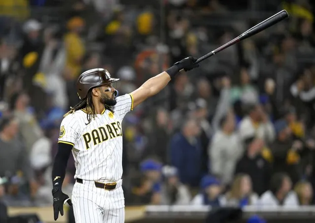 San Diego Padres' Fernando Tatis Jr. watches the flight of his two-run home run during the eighth inning of a baseball game against the Chicago Cubs, Monday, April 8, 2024, in San Diego. (Photo by Denis Poroy/AP Photo)