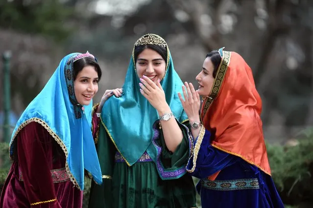 Girls talk outside the Niavaran Palace in northern Tehran, capital of Iran, March 26, 2024. People visited the Niavaran Palace during the new year vacation of Nowruz, which falls on March 20 this year. (Photo by Xinhua News Agency/Rex Features/Shutterstock)