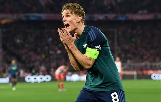 Martin Odegaard of Arsenal reacts towards a decision made by the Assistant Referee during the UEFA Champions League quarter-final second leg match between FC Bayern München and Arsenal FC at Allianz Arena on April 17, 2024 in Munich, Germany. (Photo by Stuart MacFarlane/Arsenal FC via Getty Images)