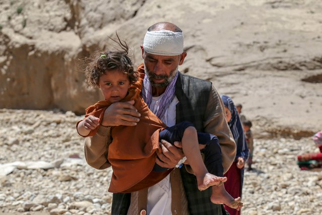 Salim, a 45-year-old man from Baghlan, who lost four of his family members in floods, visits grave of his relatives in Sherjalal village in Baghlan, Afghanistan, 12 May 2024. At least 300 people have died amid heavy floods in Baghlan province in northern Afghanistan, the United Nations Food Program (WFP) said on 11 May. The Asian country is one of the world's most vulnerable to climate change and the least prepared to adapt, according to a report by the United Nations Office for the Coordination of Humanitarian Affairs (OCHA). Much of the country's international aid and funding were frozen after the Taliban seized power in August 2021. (Photo by Samiullah Popal/EPA/EFE)