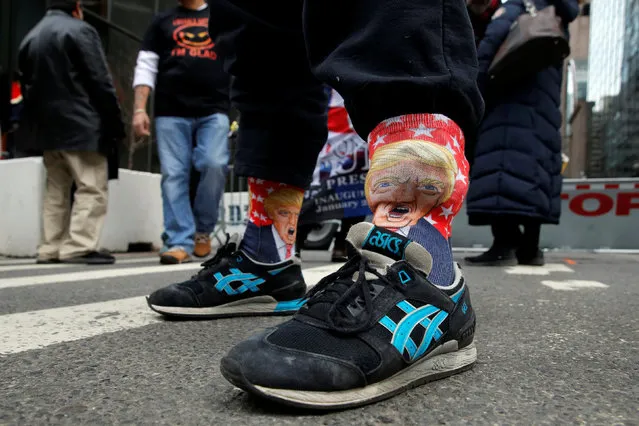 A man wears socks featuring U.S. President Donald Trump during a rally in support of Trump at Trump Tower in Manhattan, New York, U.S., February 5, 2017. (Photo by Andrew Kelly/Reuters)