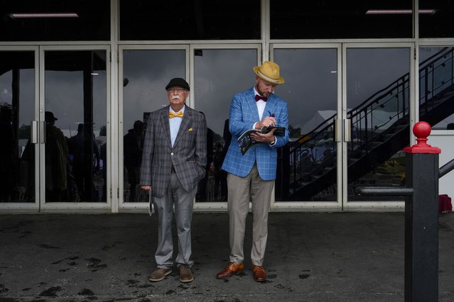 David Brauer and Andy Brauer wait for an undercard race to begin ahead of the Preakness Stakes horse race at Pimlico Race Course, Saturday, May 18, 2024, in Baltimore. (Photo by Julia Nikhinson/AP Photo)