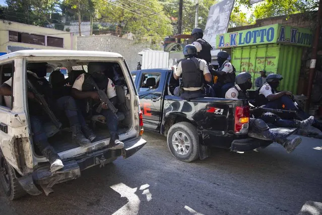 Police patrol after recovering the bodies of slain journalists in Port-au-Prince, Haiti, Friday, January 7, 2022. At least two journalists were killed by gangs on Jan. 6, according to Godson Lebrun, President of AHML, the Haitian Online Media Association. (Photo by Joseph Odelyn/AP Photo)