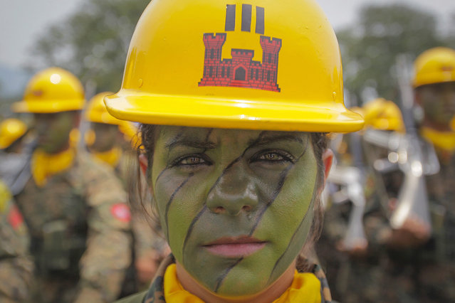 A female member of the Armed Forces of El Salvador takes part in a commemoration ceremony for Soldiers Day in San Salvador, El Salvador, 07 May 2016. During the ceremony El Salvadoran President Sanchez Ceren commented on the hard work and sacrifices made by members of the armed forces fighting criminal syndicates. (Photo by Oscar Rivera/EPA)